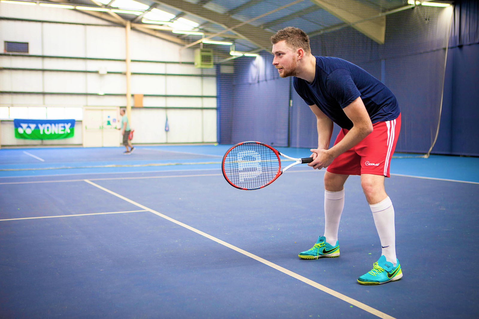 man holding a badminton racket