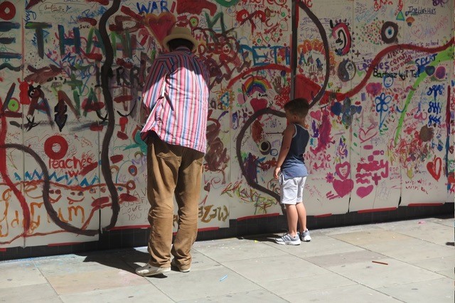 Man and child painting a wall.jpg