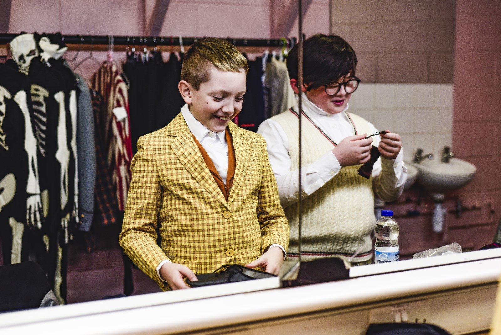 Children in costume looking in the mirror.jpg