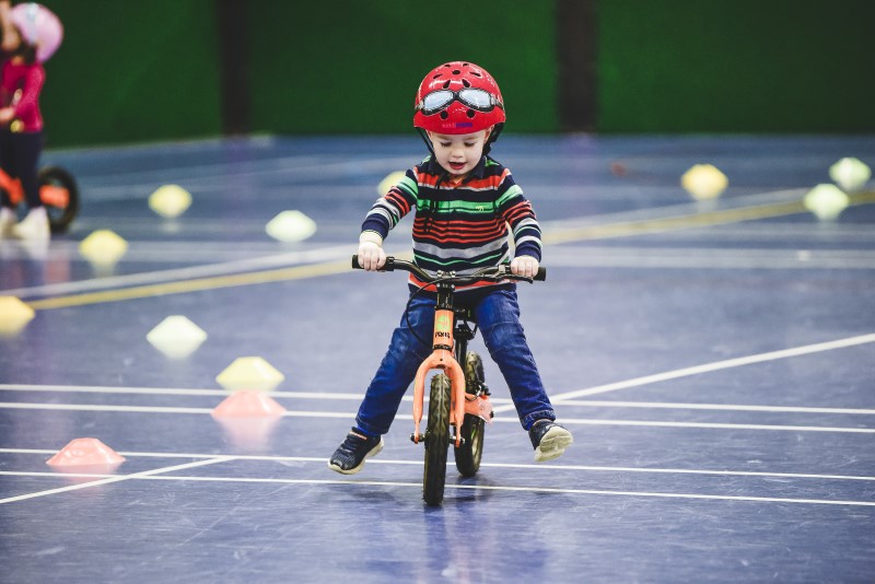 Child riding on a balance bike