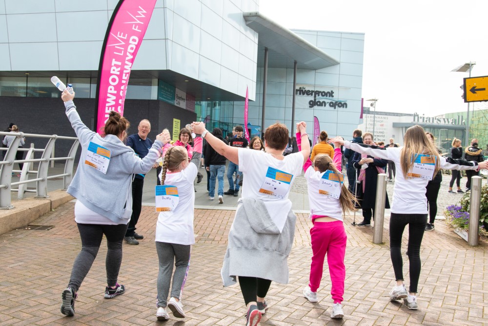 People holding hands and walking as part of the 2020 Dementia Walk