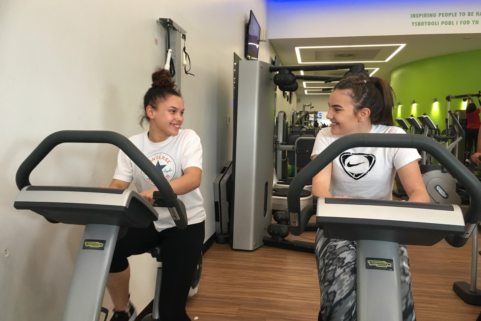 two teenagers on indoor bicycles.jpg