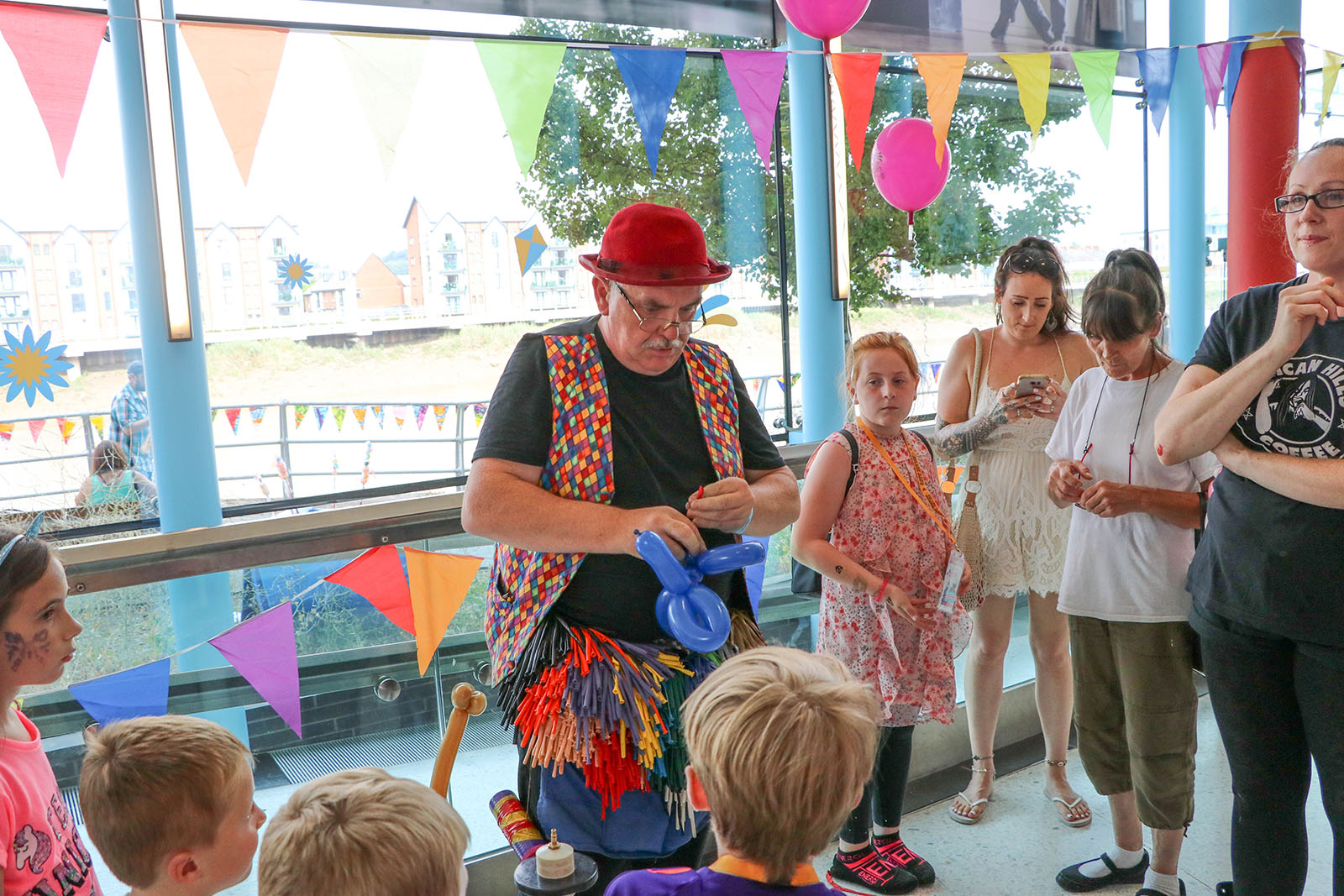 clown making balloon animals at Big Splash