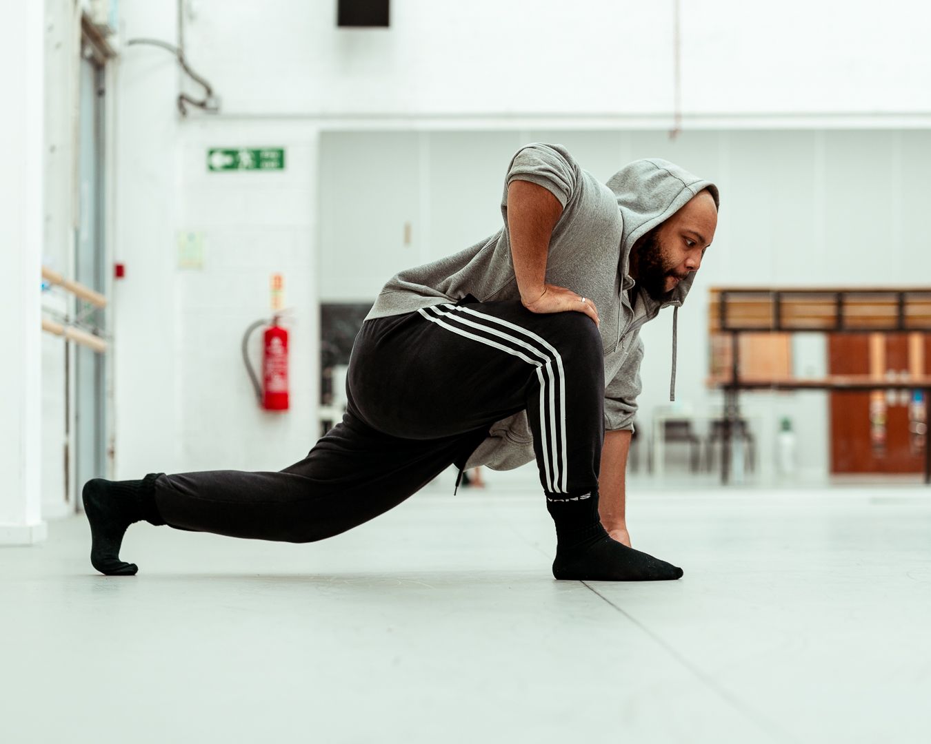 Nomah Dance man in grey hoodie