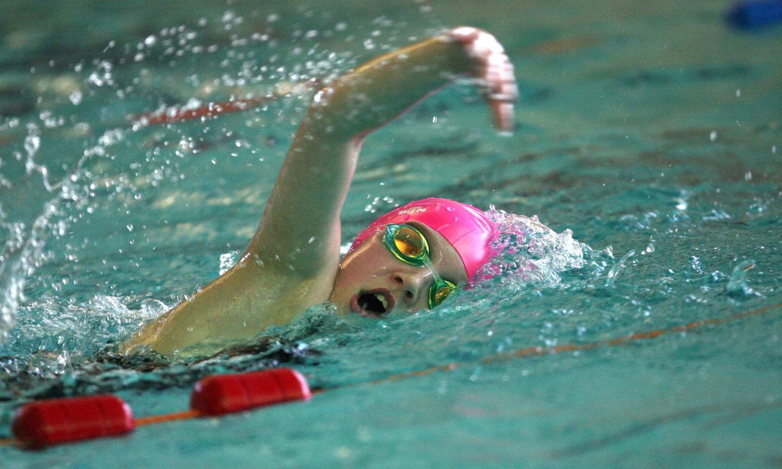 Child in Pink Swim Cap doing front crawl Child in Pink Swim Cap doing front crawl