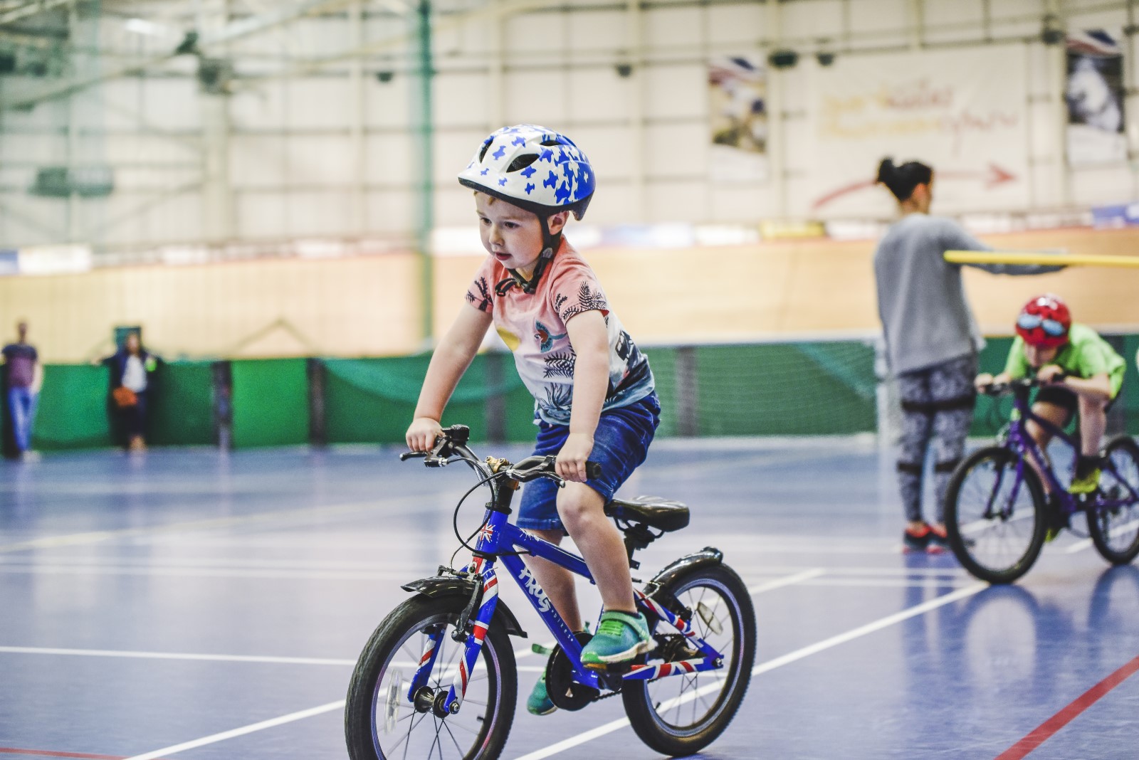 young boy riding on bicycle