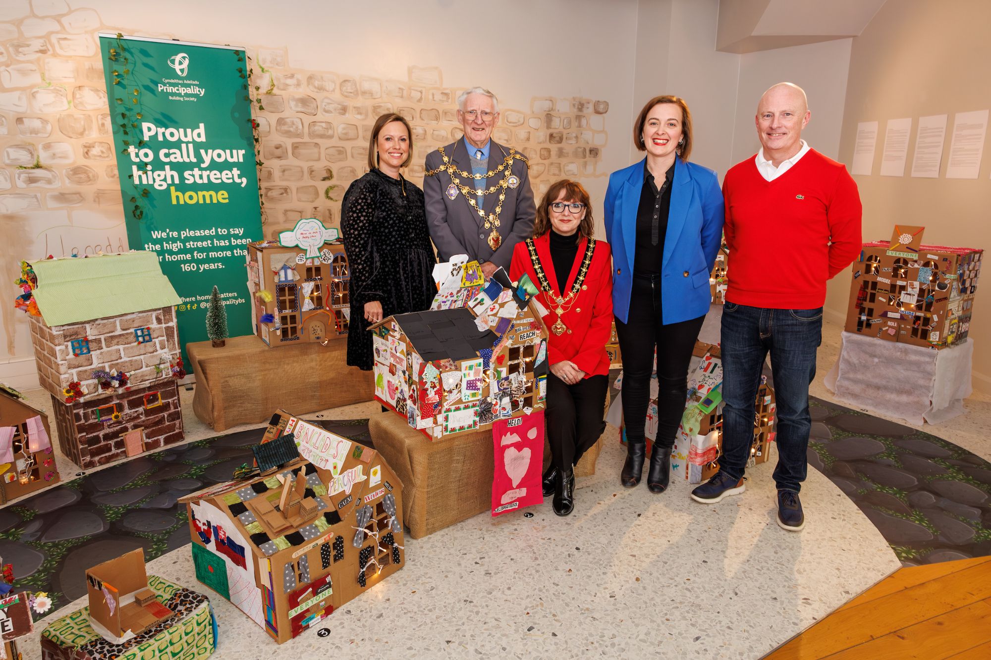 Roots and Roofs Exhibition Principle members of Principality Building Society, Dragon Mascot and Head of Theatre Gemma Durham at the Roots and Roofs Exhibition