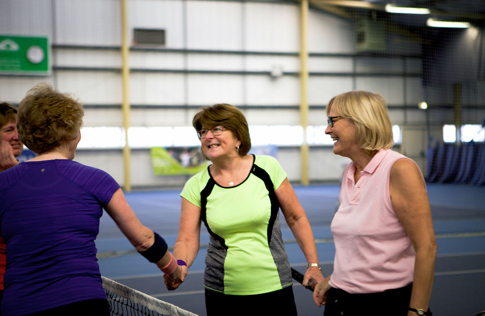 female tennis players shaking hands