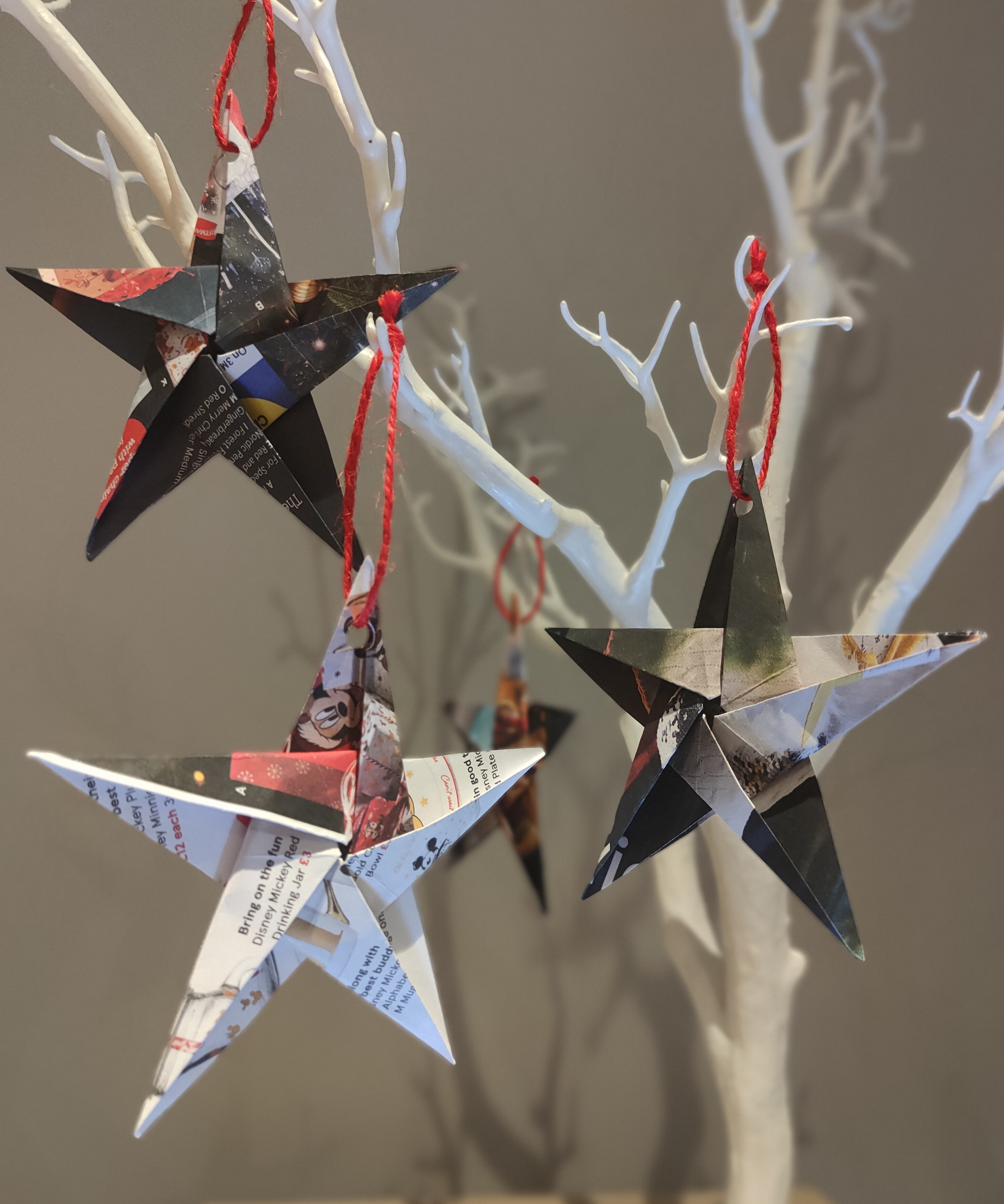 Selection of origami stars hanging from a tree.jpg