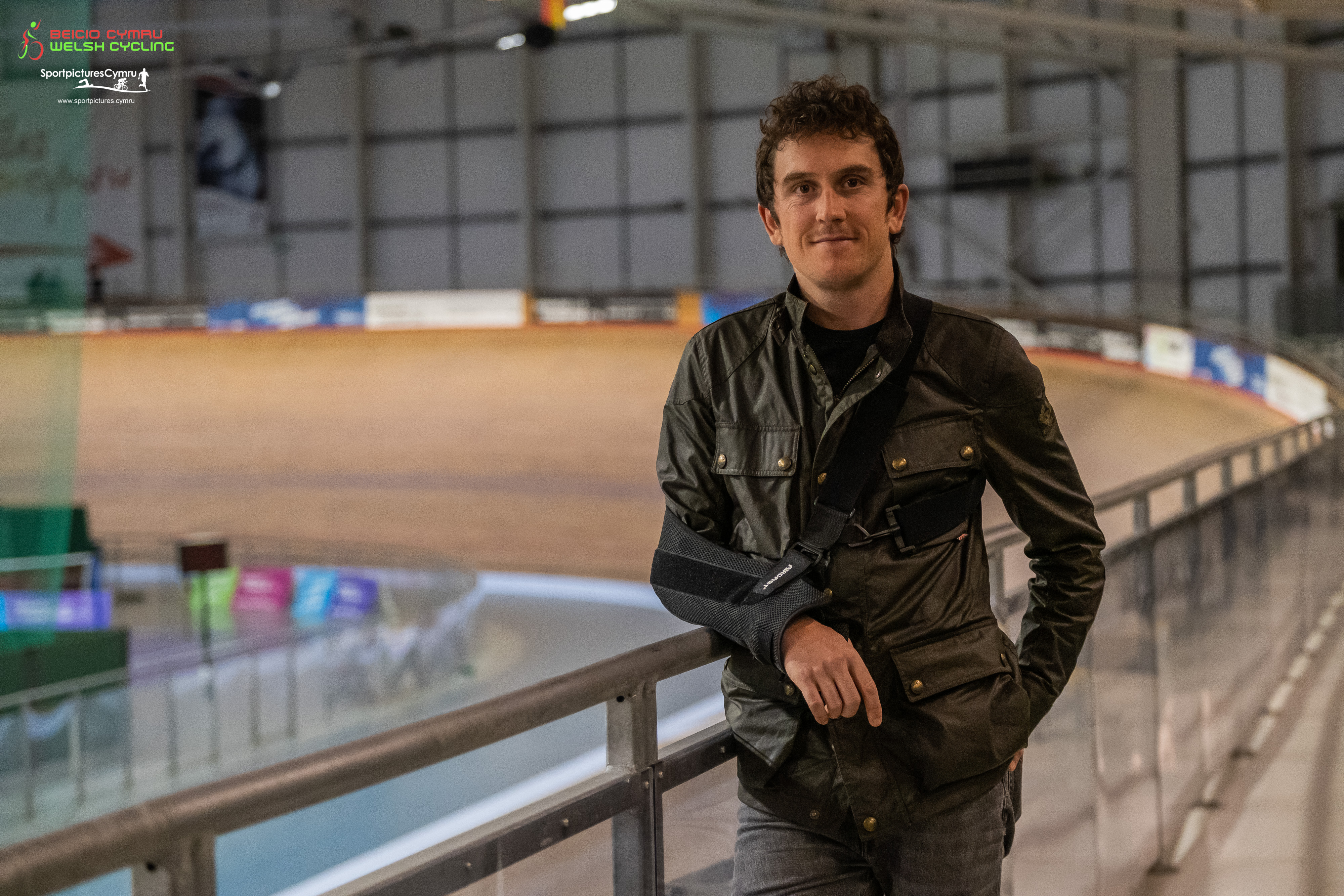 Geraint Thomas leaning against a rail in the velodrome